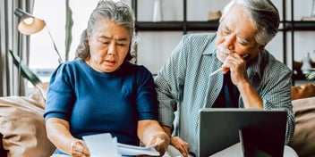 asian couple doing divorce paperwork together