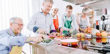 family cooking together in a kitchen