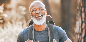 smiling man on a hike
